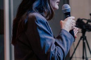 female speaking on stage